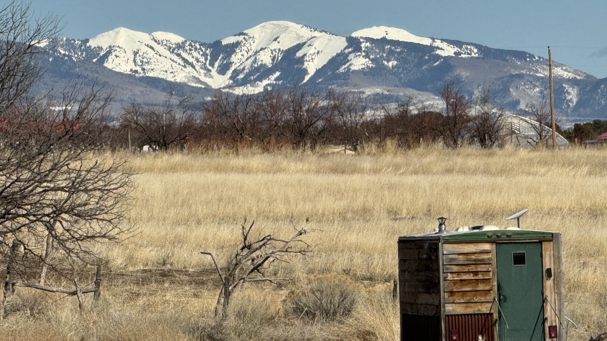 This image features the pasture from Landowner's home looking E to La Plata range