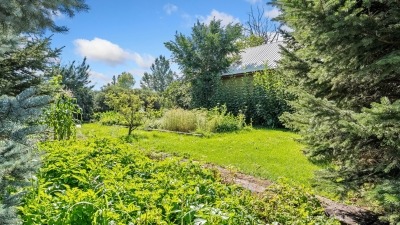 Raised beds surround the home