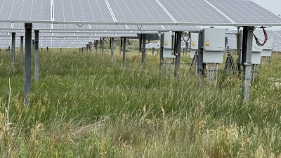 Snapshot of multiple rows of solar panels and their individual motors on the end posts. 