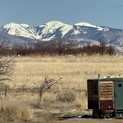 This image features the pasture from Landowner's home looking E to La Plata range