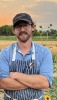Chef with Farm in background